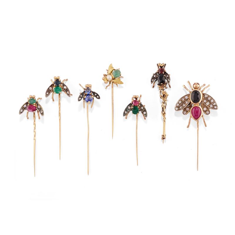 Sette spilloni con mosche
