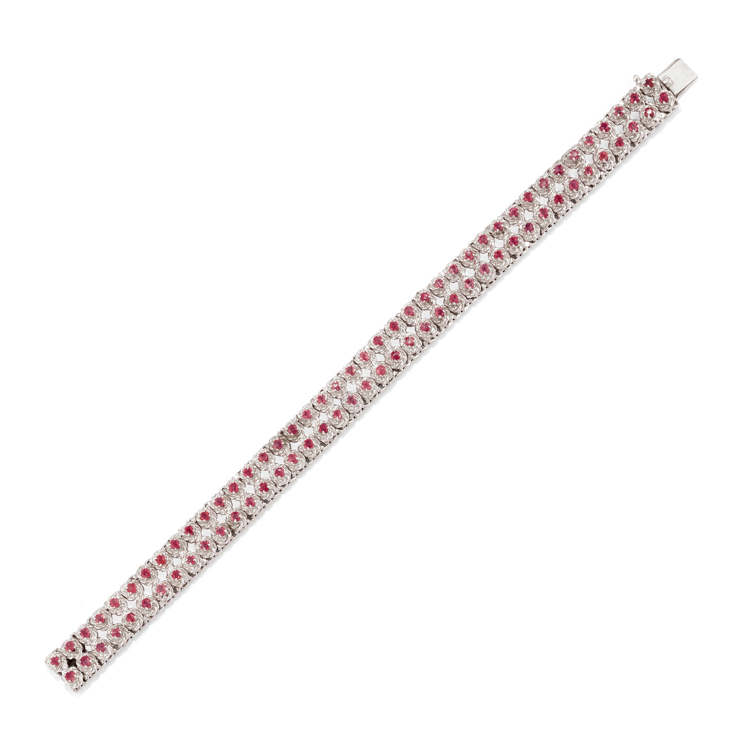 Tre bracciali in oro bianco 18k con rubini e smeraldi
