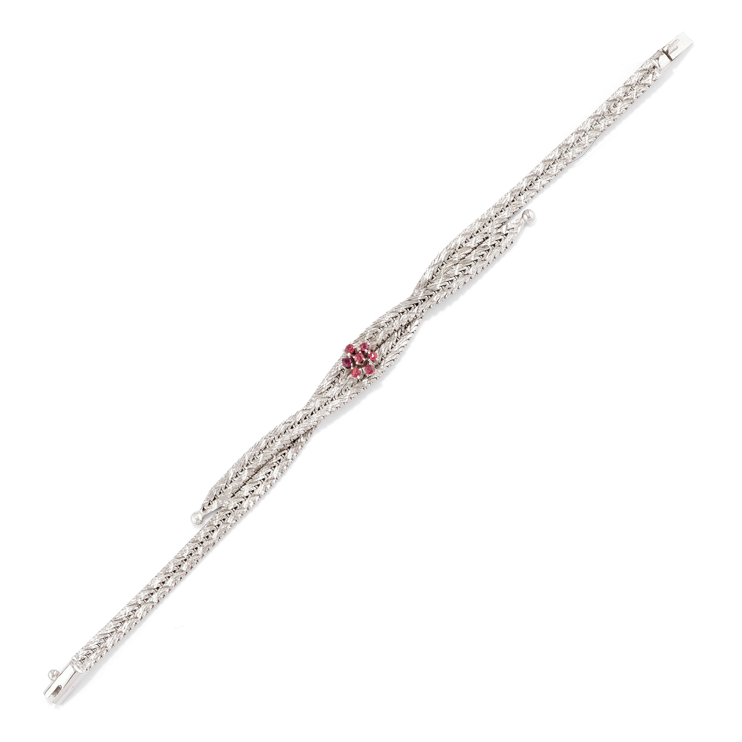 Tre bracciali in oro bianco 18k con rubini e smeraldi