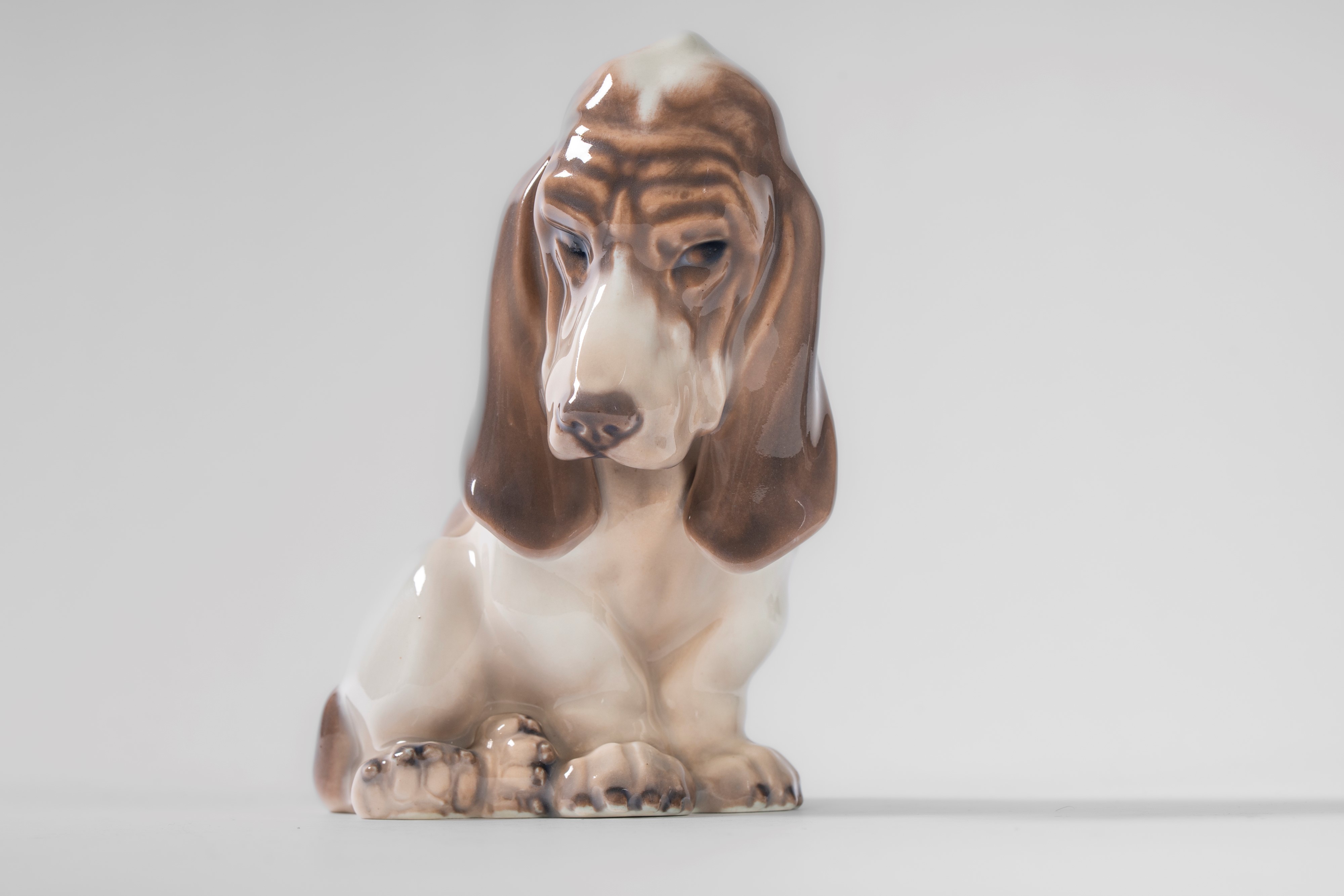 A dachshund, a Skye Terrier, and a Brussels Griffon in polychrome