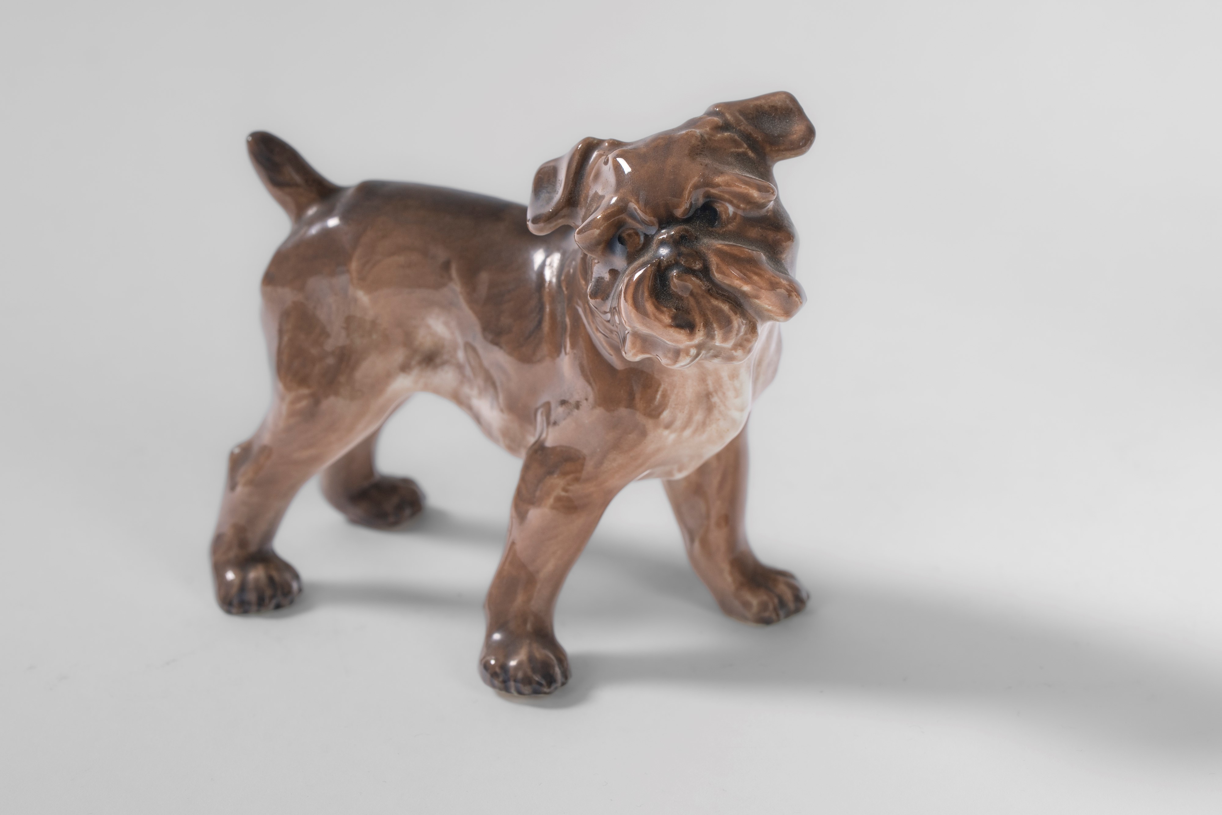 A dachshund, a Skye Terrier, and a Brussels Griffon in polychrome