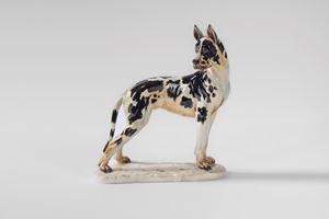 Harlequin Great Dane in polychrome porcelain on a base