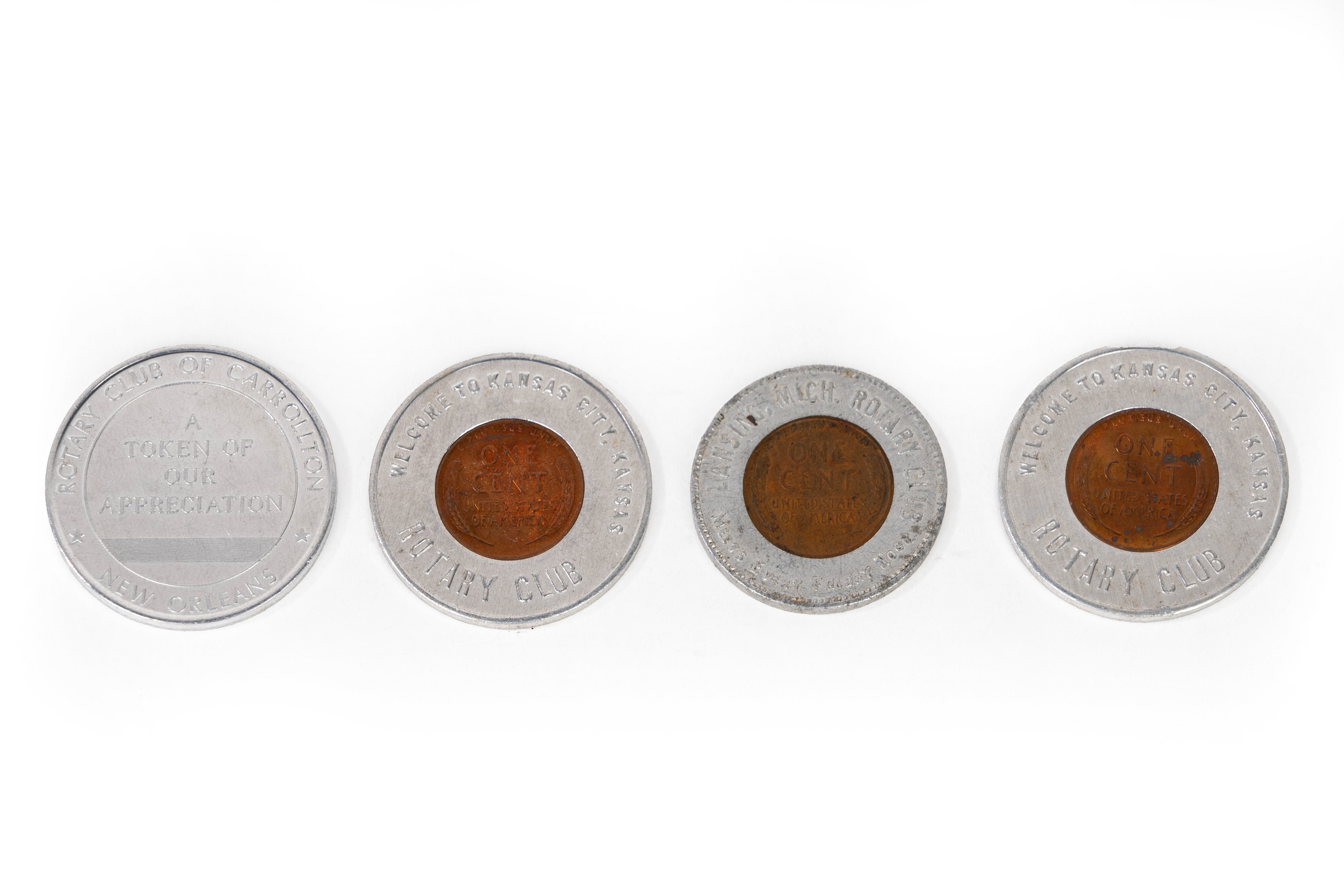 Lotto composto da quattro medaglie in metallo argentato