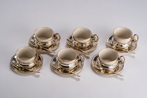 Set of six cups with saucers and eight teaspoons