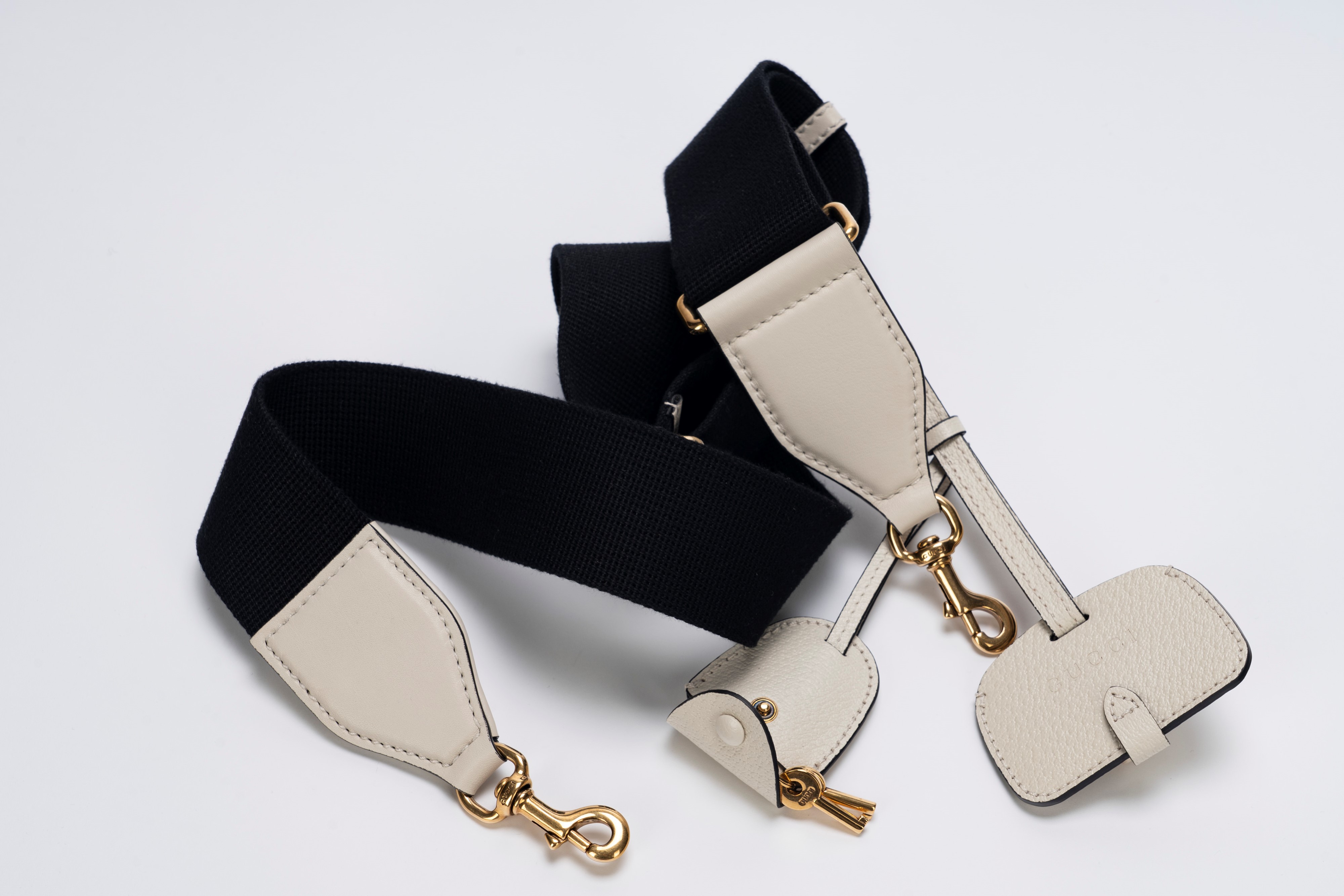 Gucci - Mini bauletto, tela logata nera e pelle di cinghiale color panna