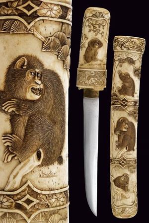 Tanto in bellissima montatura d'osso