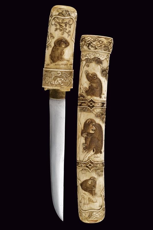 Tanto in bellissima montatura d'osso