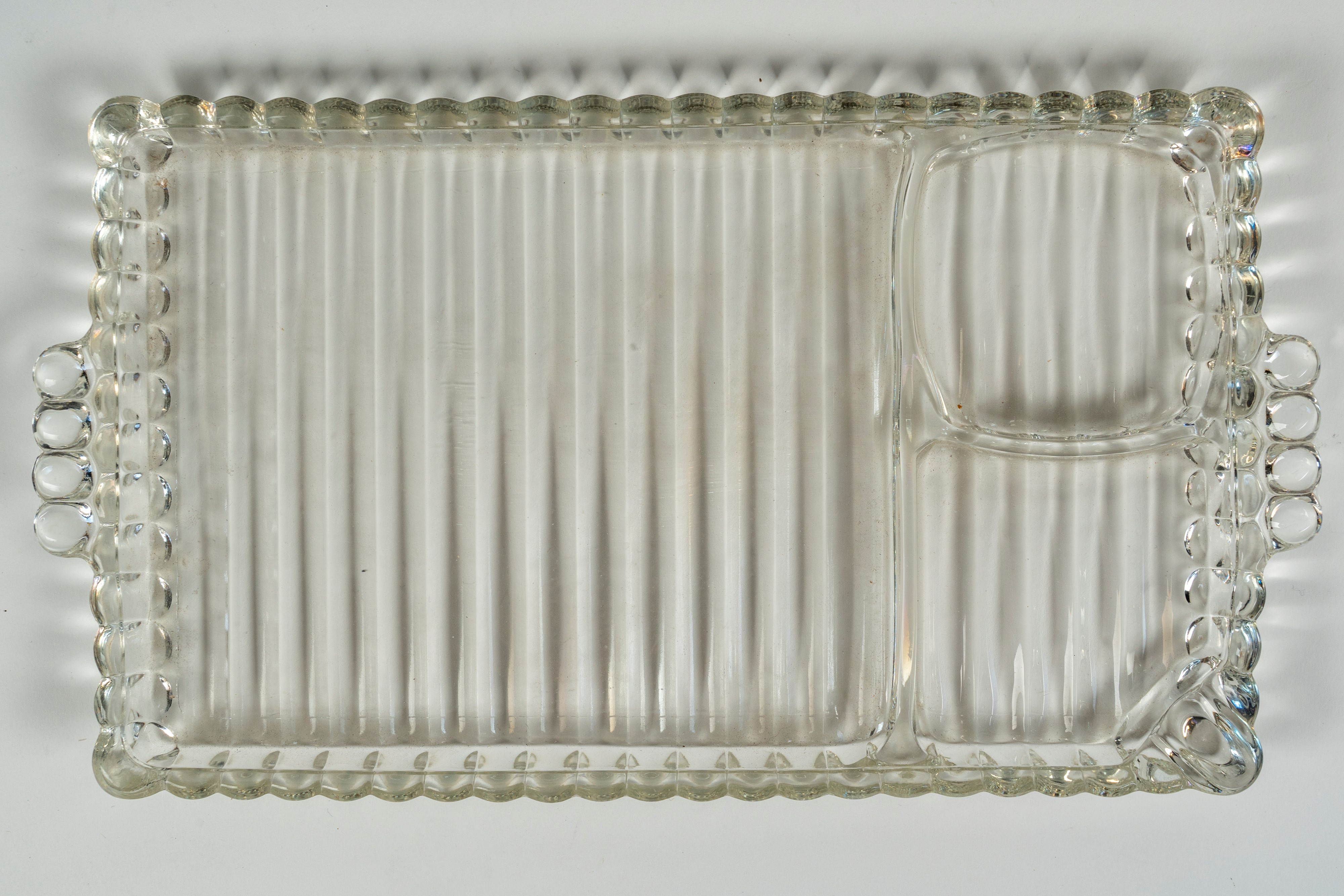 Sette vassoietti da antipasto biansati in vetro costolato trasparente