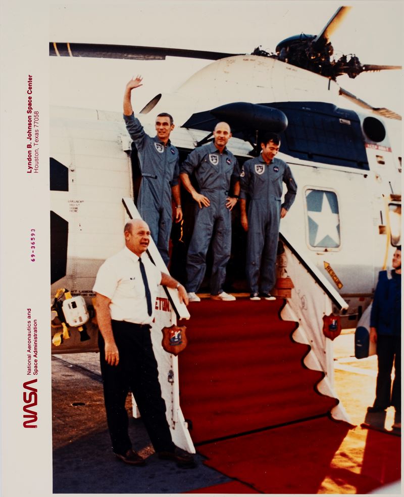 The Apollo 10 astronauts Thoms P. Stafford, J. W. Young and E. A. Cernan are greeted by D. E. Stu...