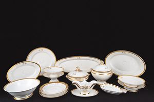 White porcelain set with gold trim. Decorated with the "GB" monogram.