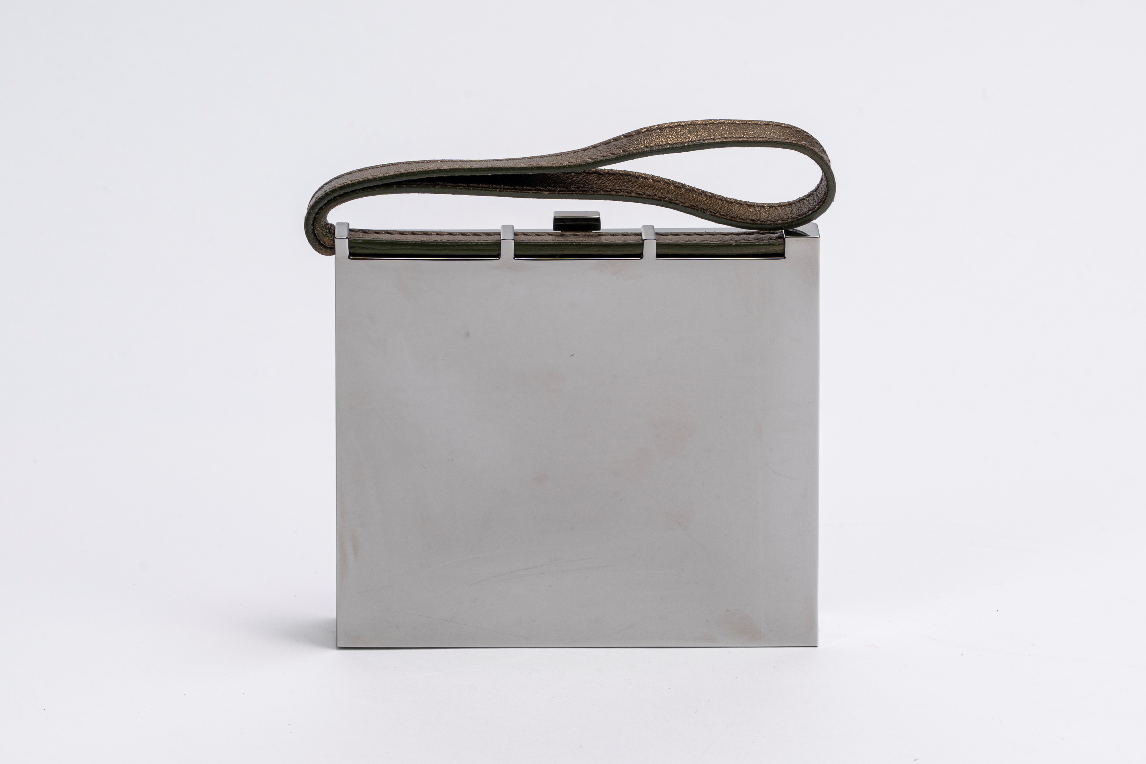 Yves Saint Laurent - Clutch, in metallo con manico a bracciale in pelle color bronzo