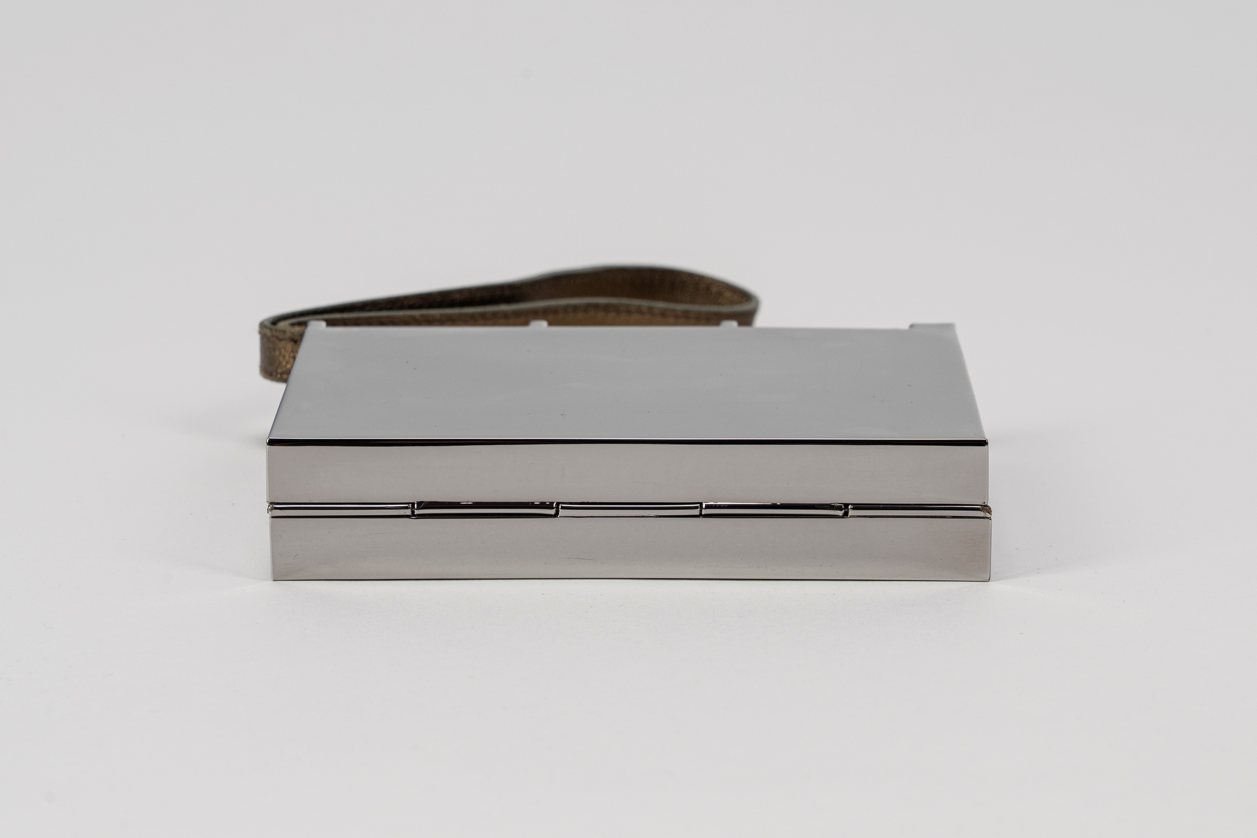 Yves Saint Laurent - Clutch, in metallo con manico a bracciale in pelle color bronzo