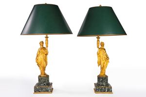 A pair of gilded bronze and green marble bouillotte lamps with supports featuring draped female figures in the round. France, 19th century.