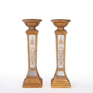 Pair of gilded wooden candlesticks with faceted and mirrored stems. 11th century.