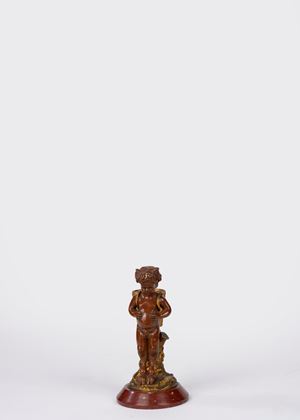 Fauno in bronzo dorato e patinato su base in marmo rosso. Secolo XIX