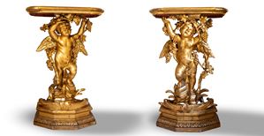 Coppia di consoles in legno scolpito e dorato con piano laccato a finto marmo. Secolo XVIII/XIX