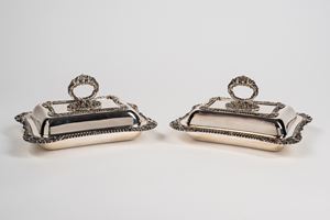 Pair of Sheffield vegetable dishes with curved edges and ring handle decorated with shell and leaf valves