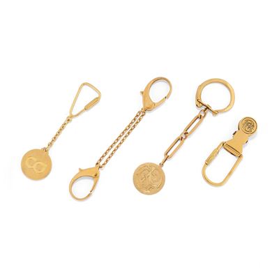 Quattro portachiavi, in oro giallo 18k