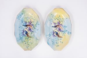 Pair of porcelain serving plates decorated in polychrome with birds on flowering branches, Limoges, France