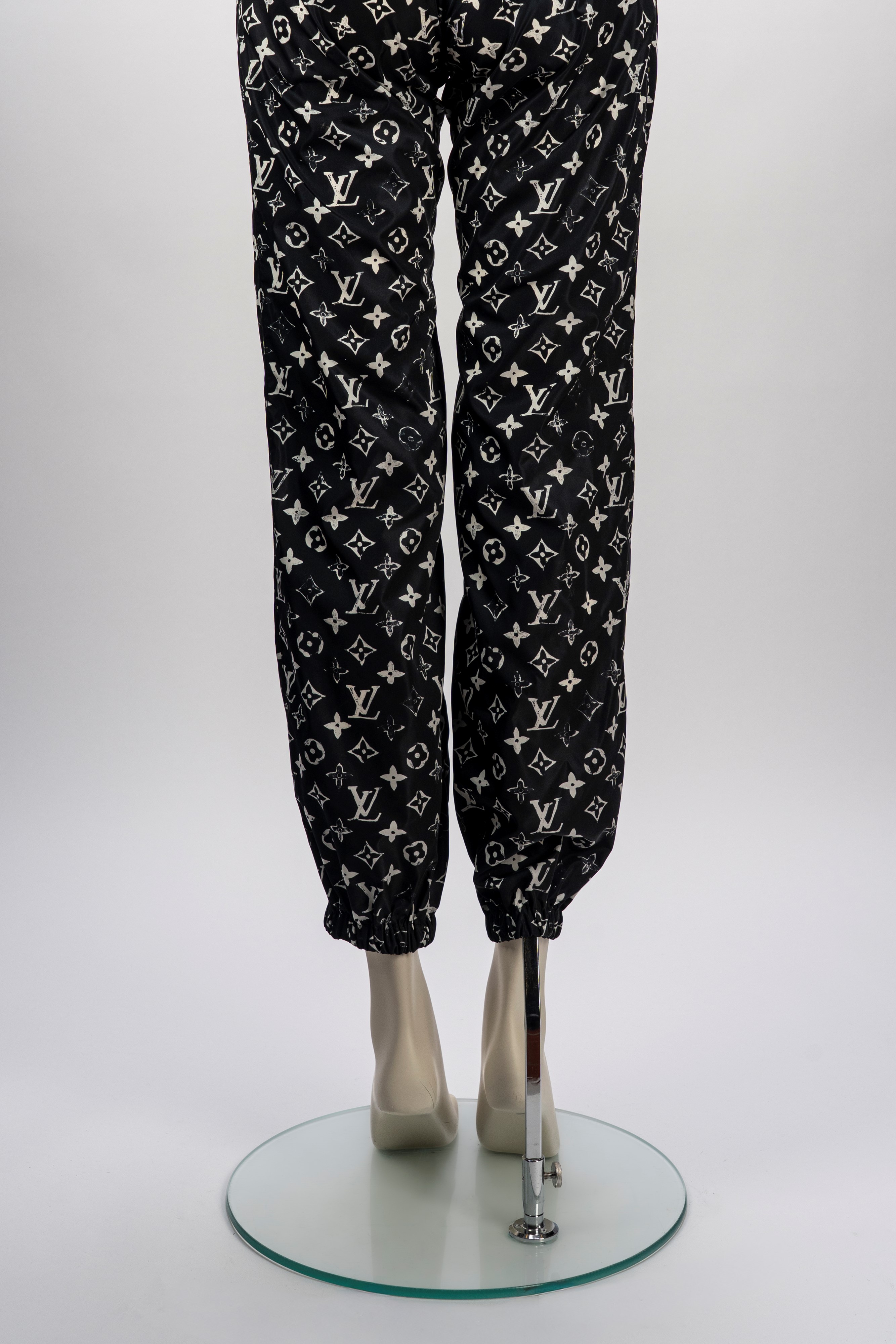 Louis Vuitton - Pantaloni, tessuto tecnico impermeabile con stampa monogram bianco