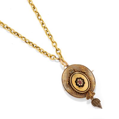 Collana, in oro giallo a bassa caratura con maglia ad anelli e pendente floreale