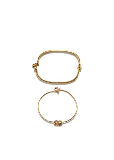 Due bracciali rigidi in oro giallo 18k