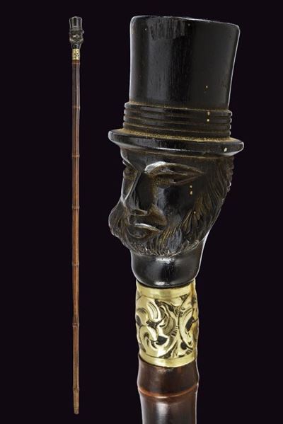 Francia, Bastone da passeggio con pomo in ebano scolpito e ghiera in argento, 1900 circa