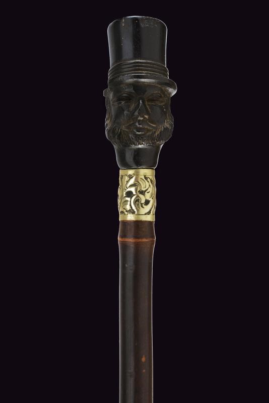 Francia, Bastone da passeggio con pomo in ebano scolpito e ghiera in argento, 1900 circa