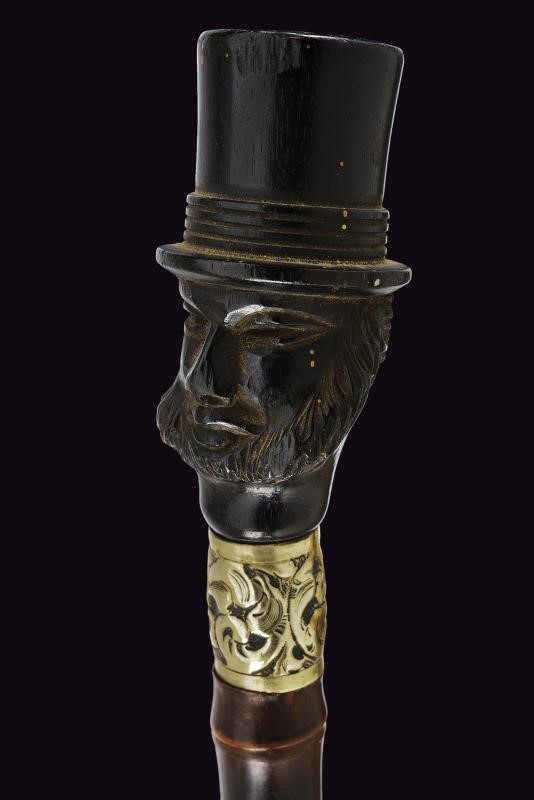 Francia, Bastone da passeggio con pomo in ebano scolpito e ghiera in argento, 1900 circa