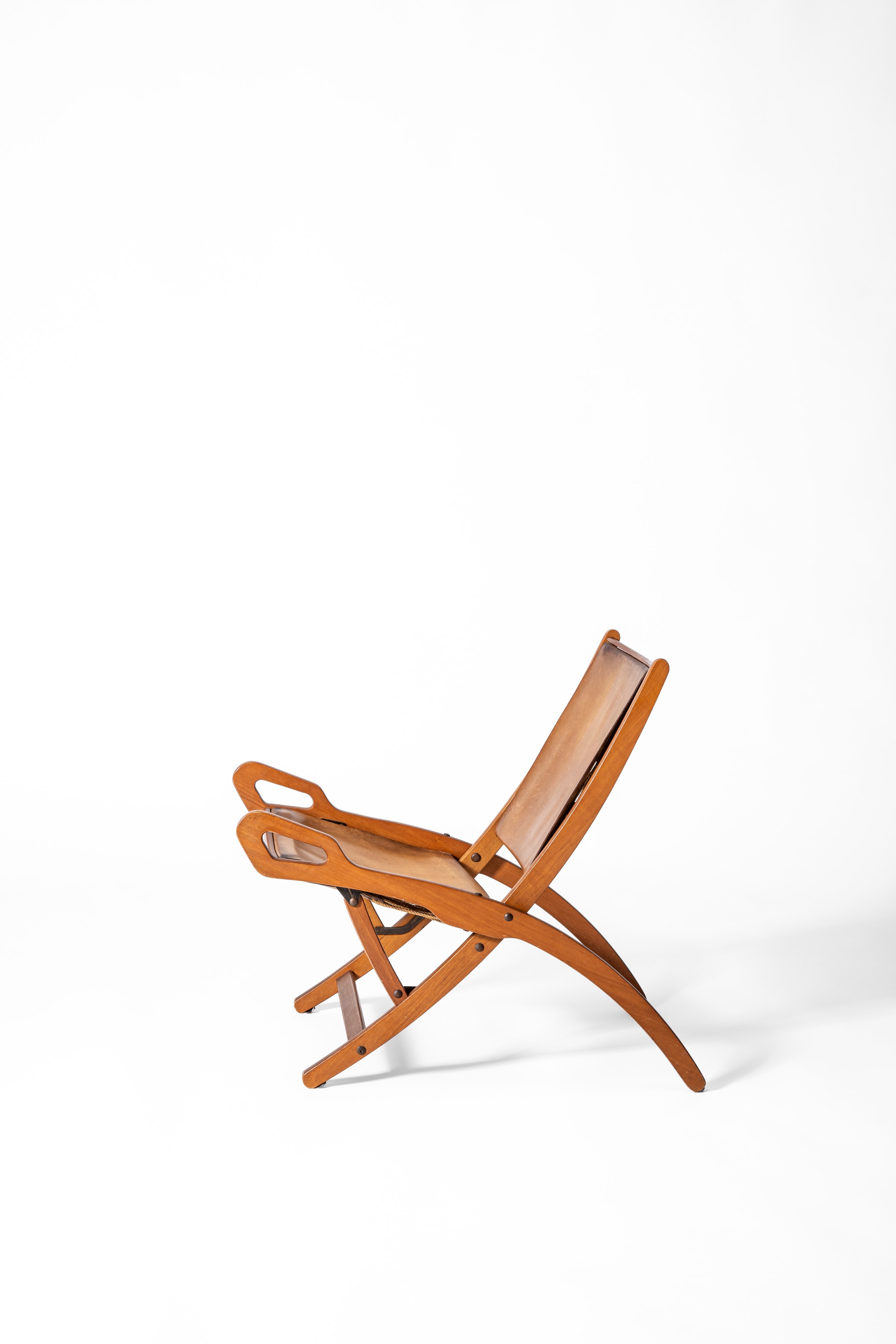 Gio Ponti - Sedia pieghevole “Ninfea”, legno, ottone e pelle