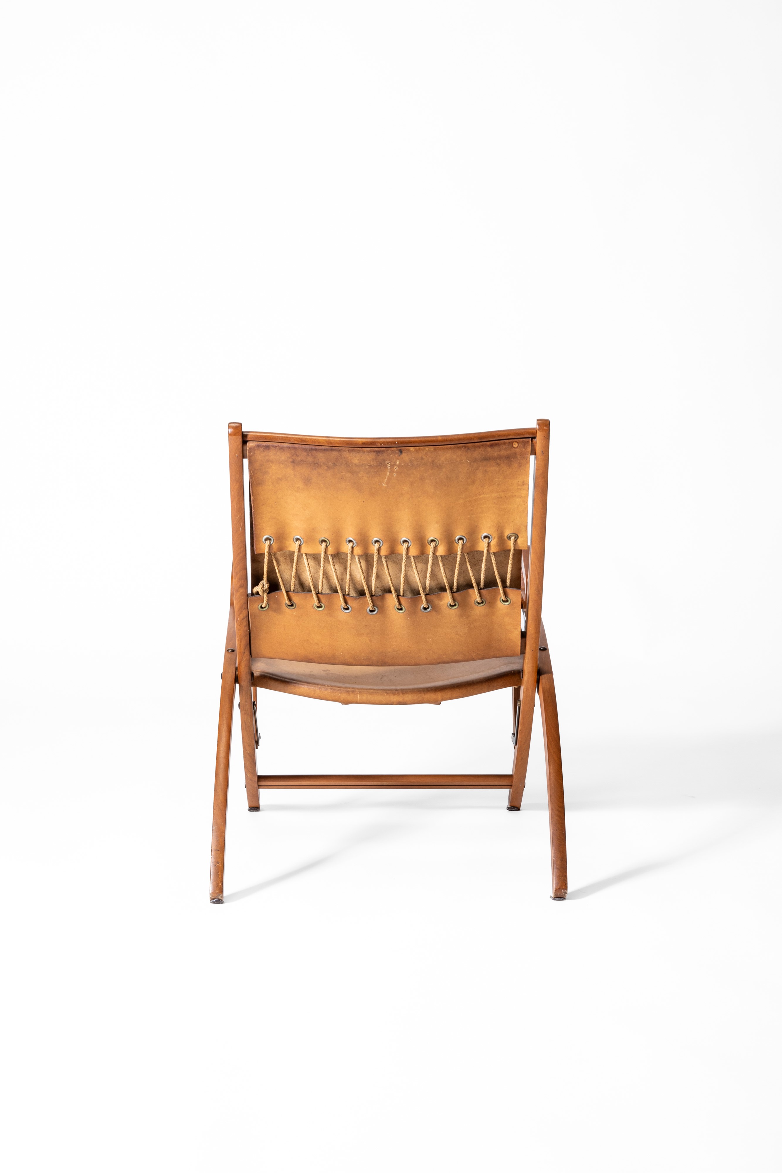 Gio Ponti - Sedia pieghevole “Ninfea”, legno, ottone e pelle