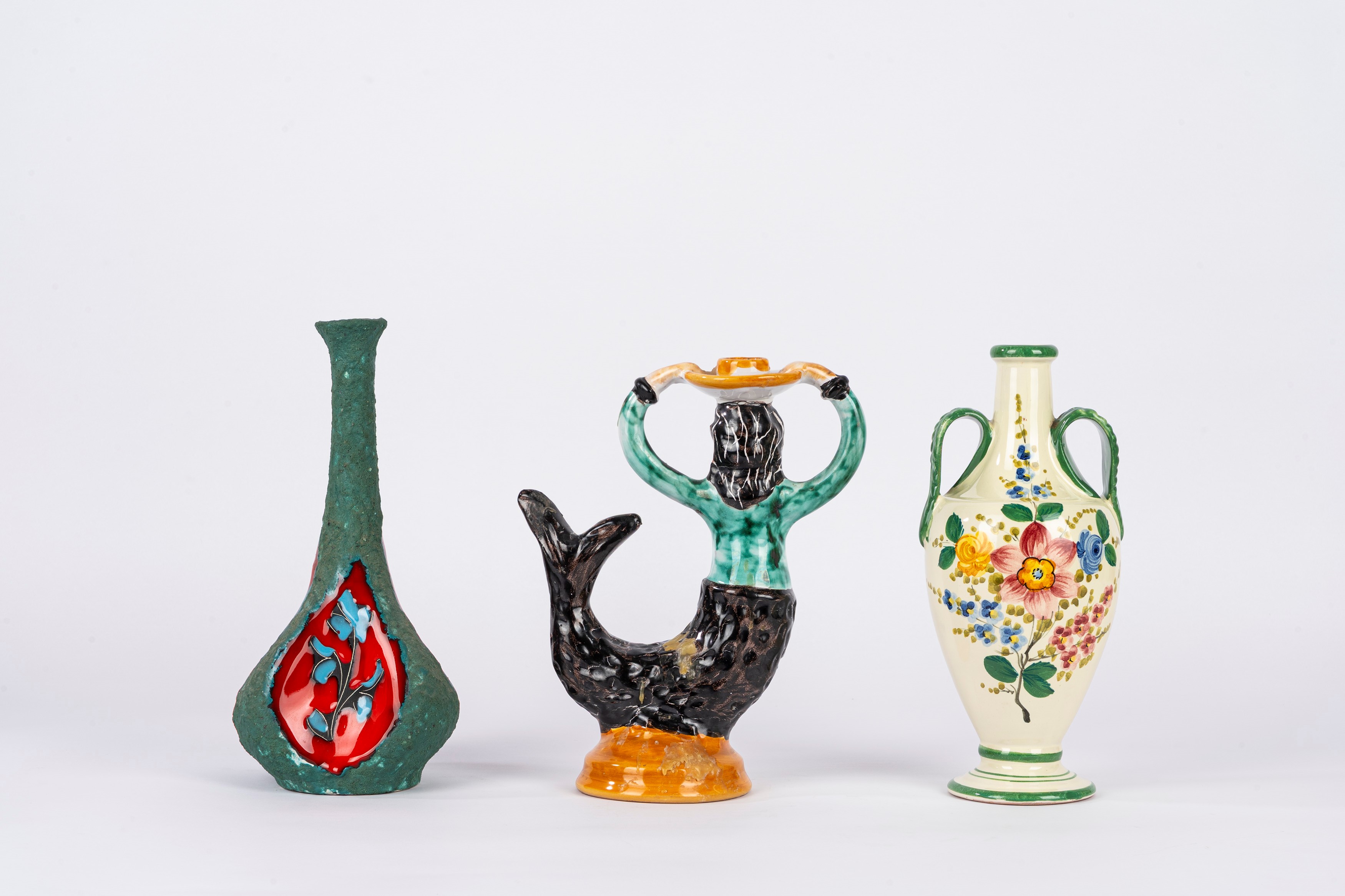 Manifattura di Positano, Candeliere a forma di sirena in ceramica policroma; Deruta, Coppia di bo...