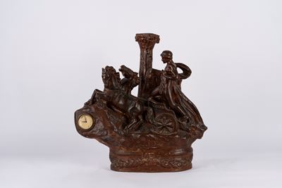 Scultura raffigurante auriga, terracotta smaltata a finto bronzo, con orologio