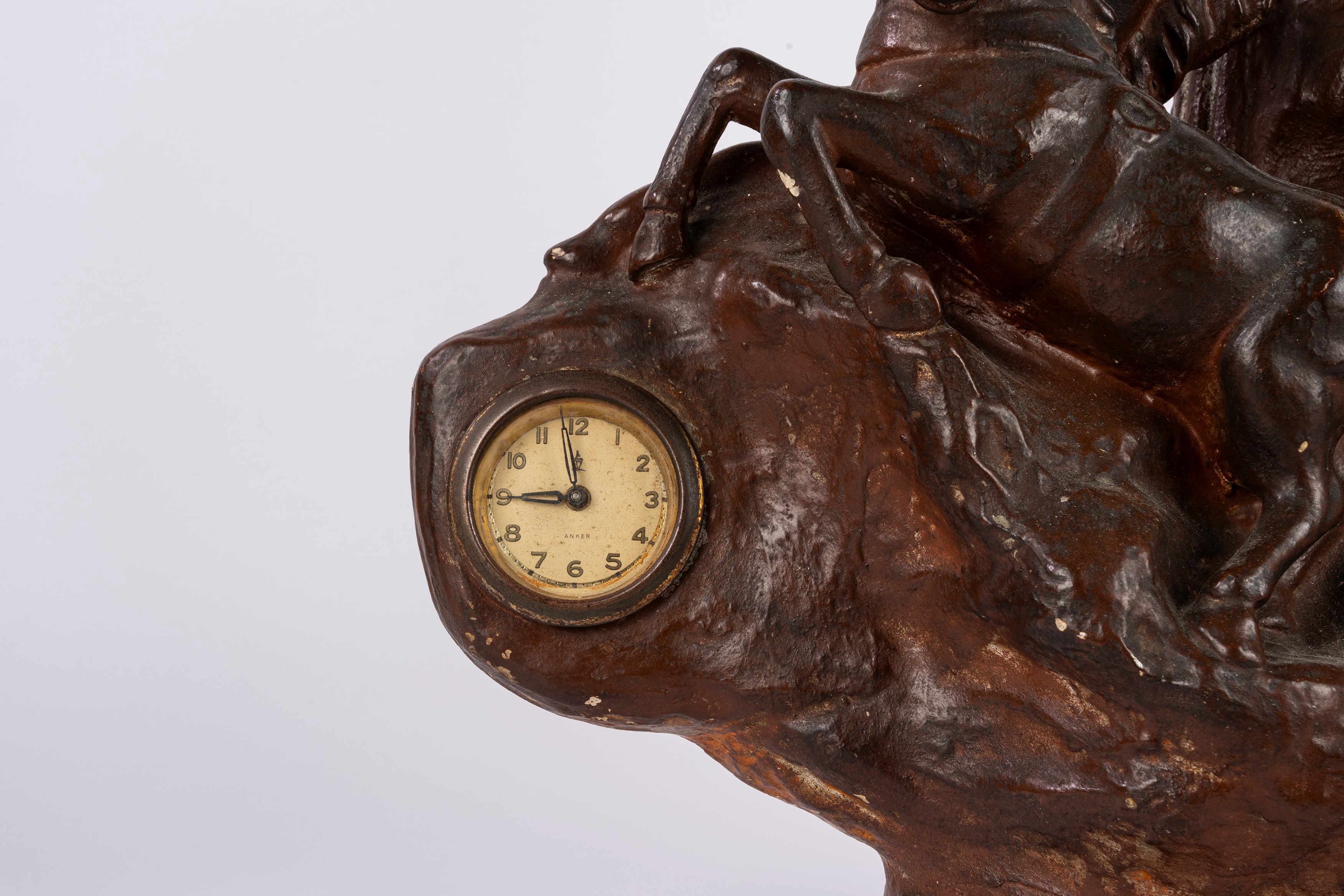 Scultura raffigurante auriga, terracotta smaltata a finto bronzo, con orologio