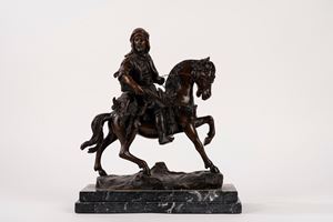 Scultura in bronzo raffigurante cavaliere arabo a cavallo