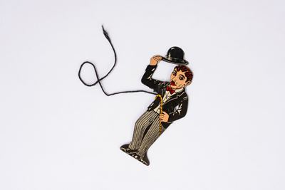 Anonimo, Figura animata CHARLOT in latta litografata (meccanismo a levetta), anni 1930