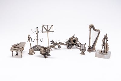 Gruppo di nove toys, in argento e metallo argentato, metà sec. XX