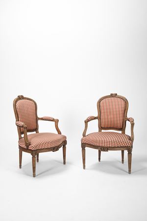 Pair of armchairs in carved and shaped soft wood