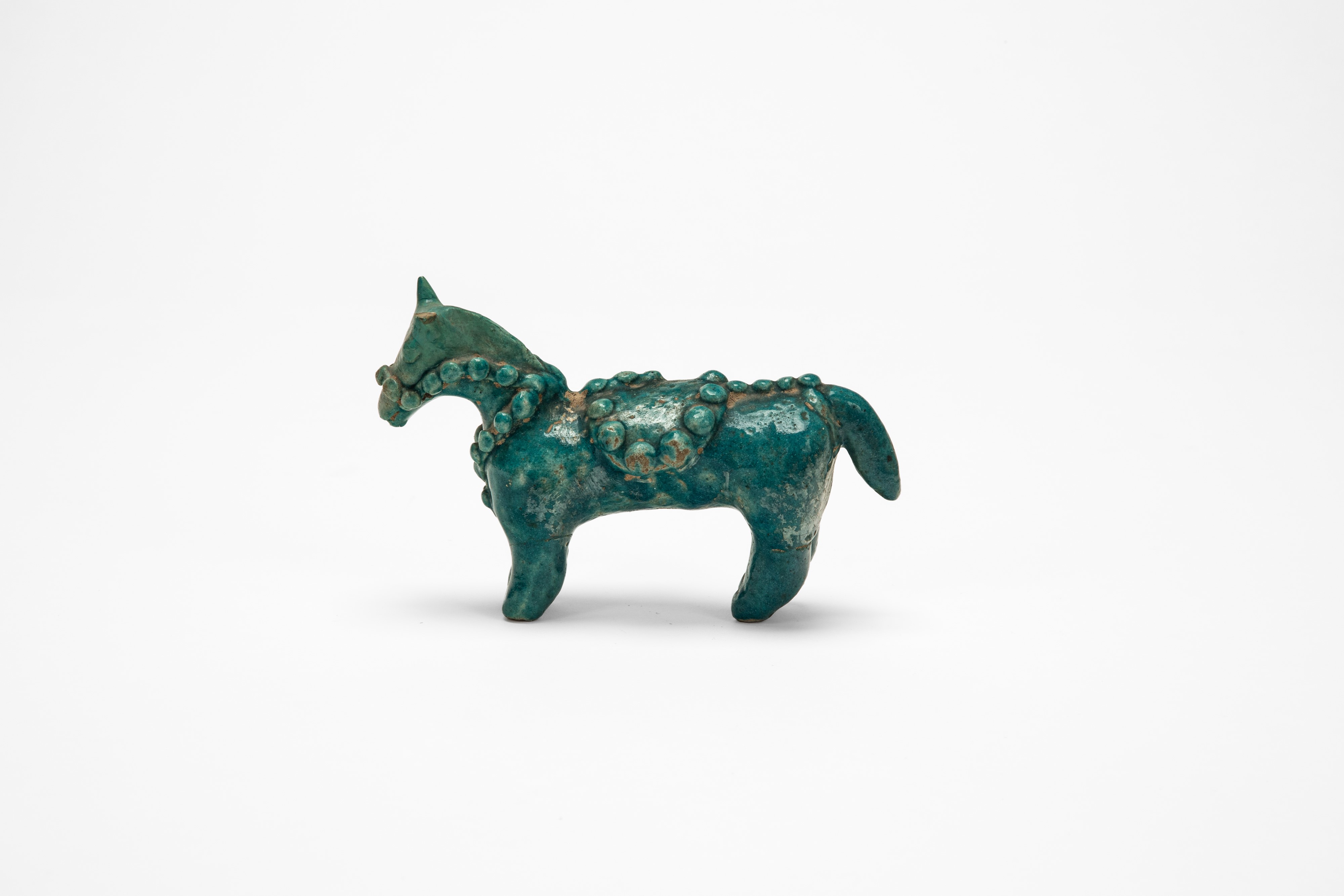 Antico cavallino persiano, ceramica invetriata monocroma turchese