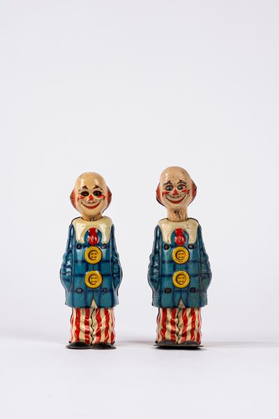Due Happy Clown in latta litografata con meccanismo a molla