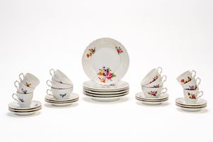 Six-piece porcelain tea and coffee set with a raised, wavy edge and floral decoration. Richard Ginori