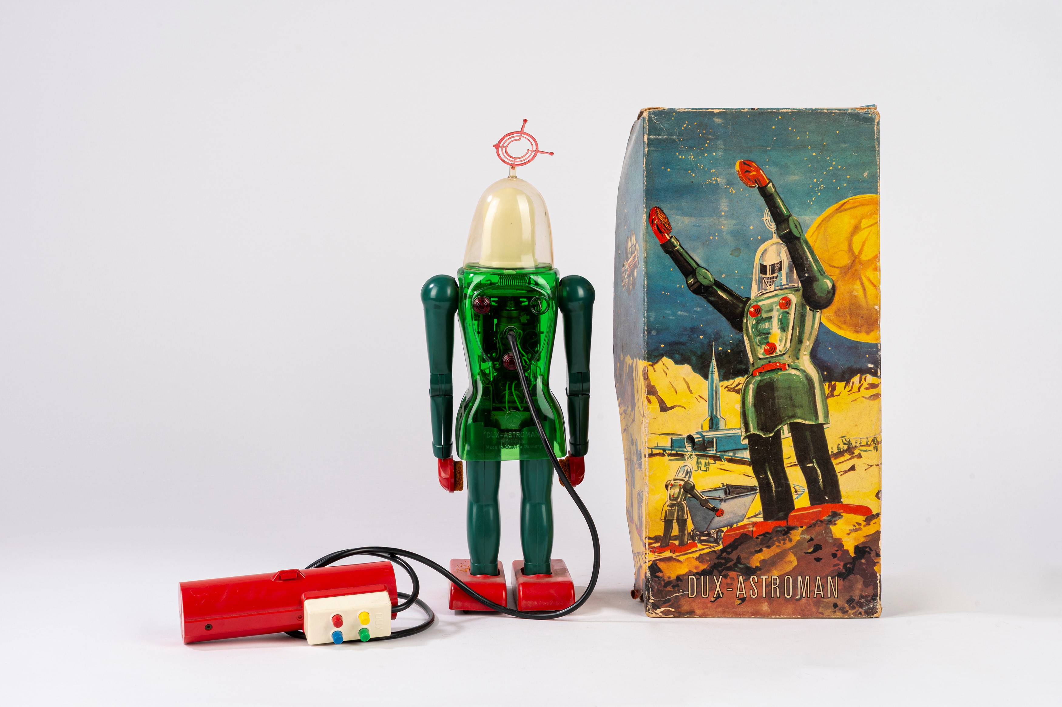 Dux - Robot giocattolo “ASTROMAN”, plastica con telecomando, funzionamento a batteria (anni 1950)