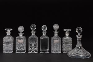 Six bottles and a decanter in Bohemian crystal