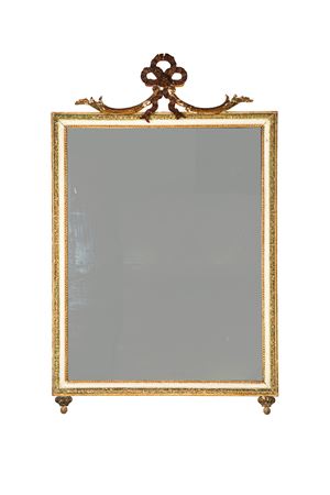 Specchiera in legno intagliato, laccato e dorato. Secolo XIX