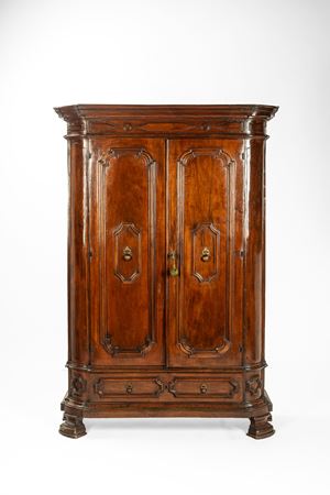 Two-door walnut wardrobe. Lombardy, 18th century.