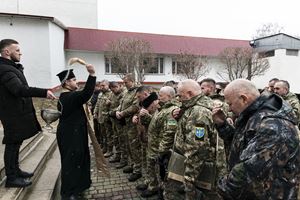 Ternopil, volunteers receive a blessing from the local priest before heading to the front line during the early days of the 2022 invasion