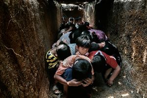 The children at a school in Demoso take shelter in an air-raid bunker. The Burmese military frequently bombs schools to intimidate the population