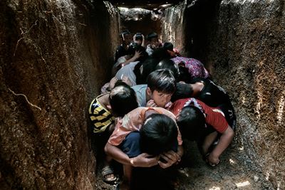 The children at a school in Demoso take shelter in an air-raid bunker (Fine Art Museum Etching su...