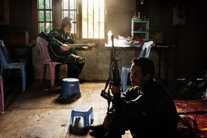 The young Burmese revolutionaries are fighting the military that carried out the 2021 coup in Myanmar. In the photo, a young KNDF fighter holds a guitar while on the front line in Loikaw.