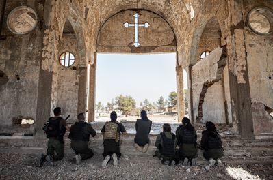 Soldiers from the Nutoro unit pray among the ruins of Idia Bet Maryam Adishta (Church of the Virg...